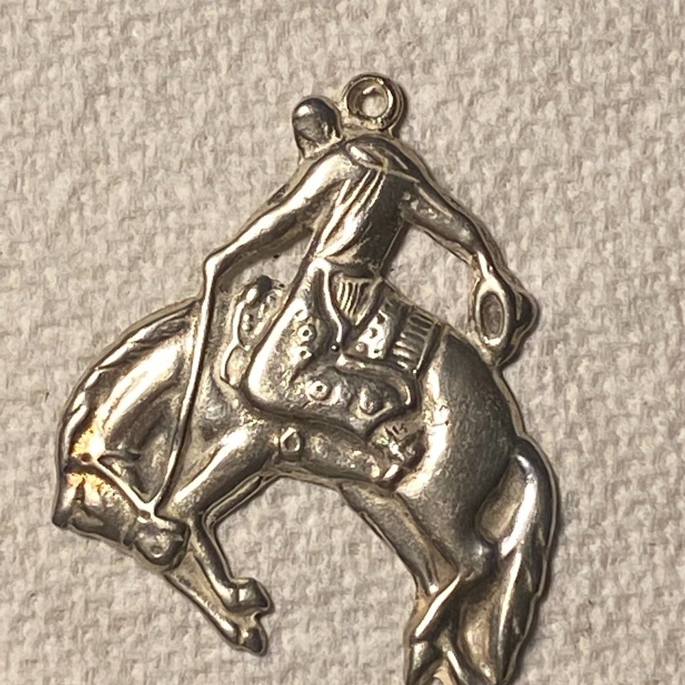 Sterling silver bucking bronco pendant